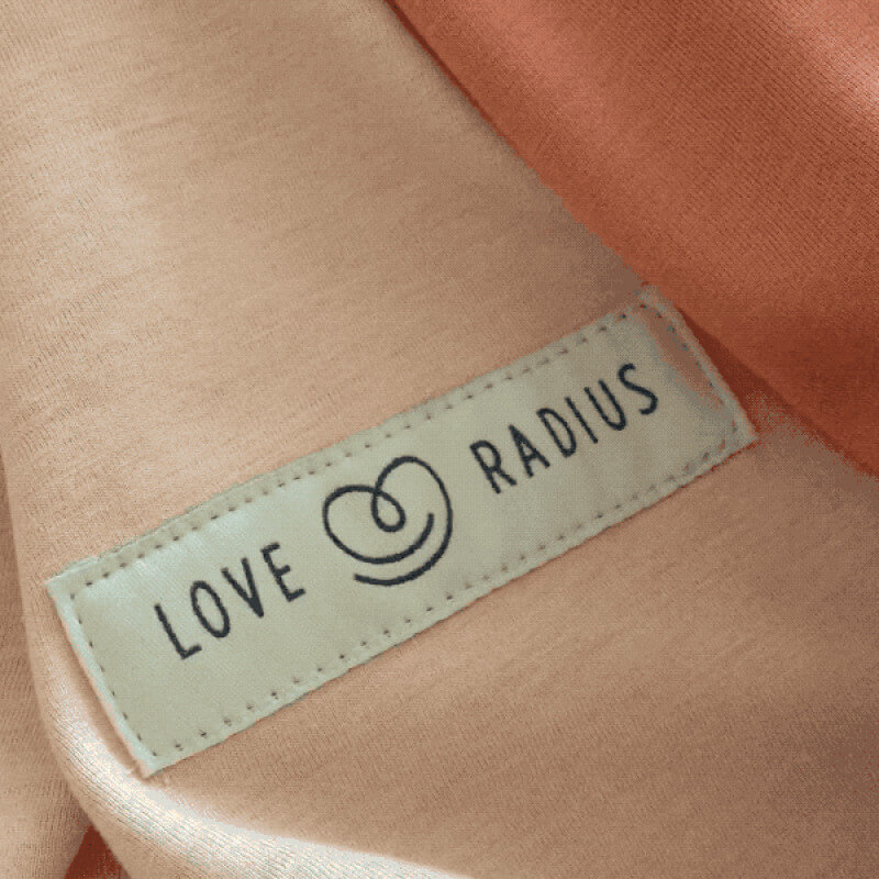 Love Radius reversible sling nude caramel, brand label detail on fabric