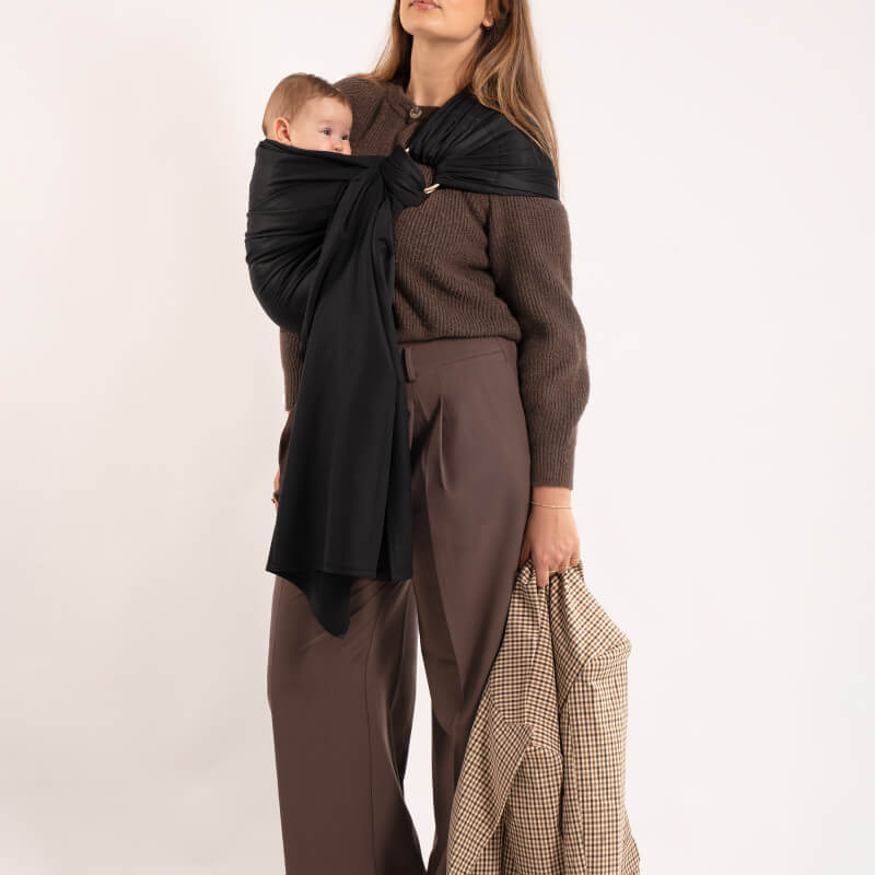 Love Radius Les Imparfaits woven sling baby carrier worn by mother with baby, full front view